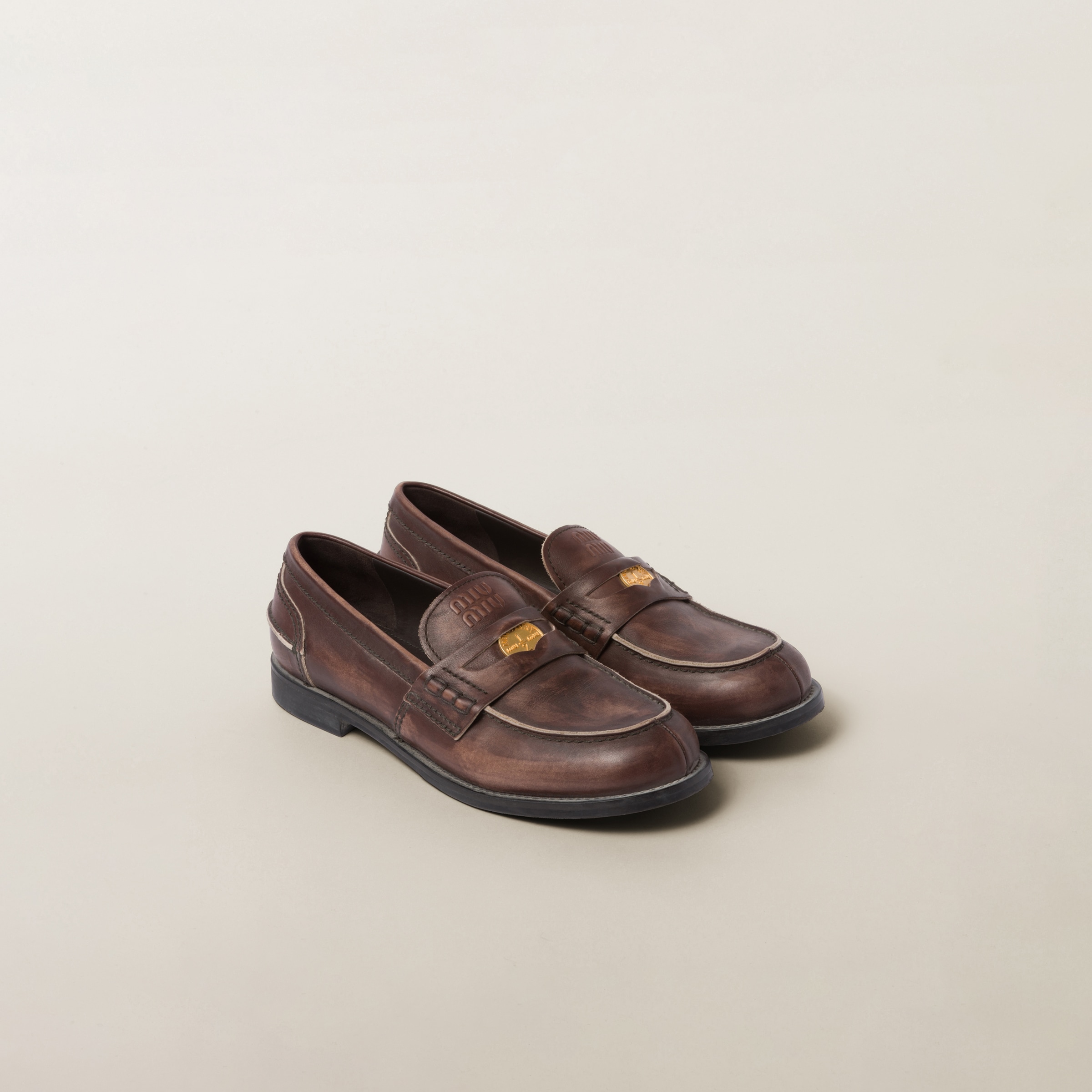 Black Brushed Leather Penny Loafers | Miu Miu