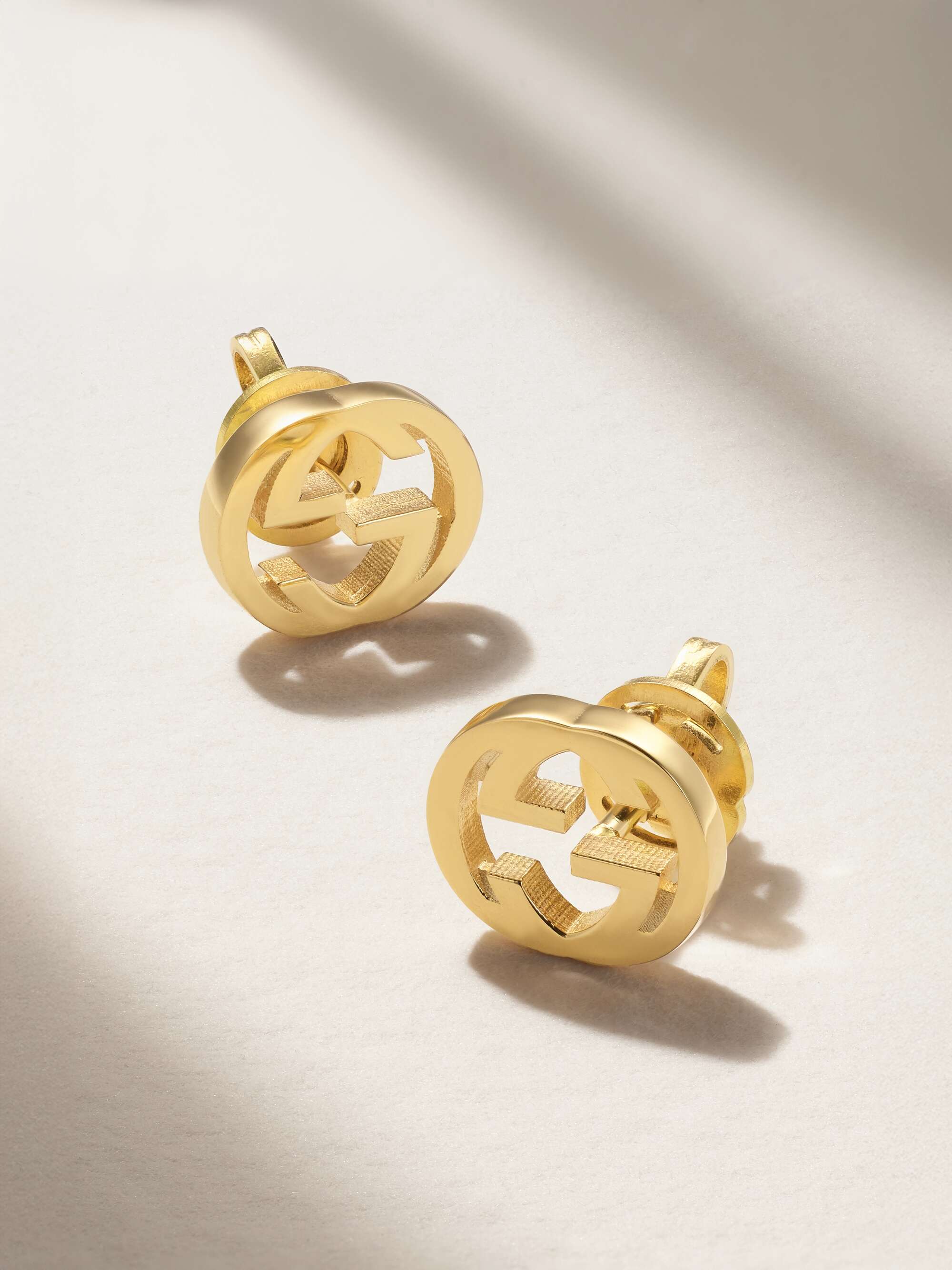 GUCCI Interlocking G 18-karat gold earrings | NET-A-PORTER