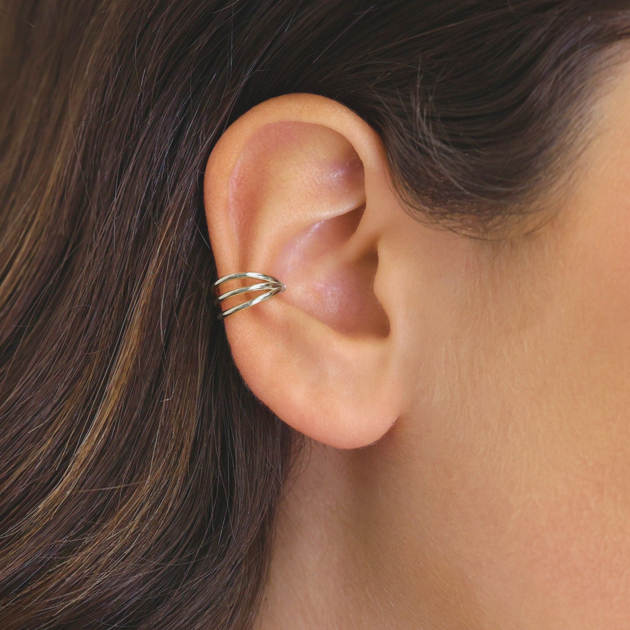 Conch Ear Piercing With Titanium Hinged Segment Triple Hoop Ring