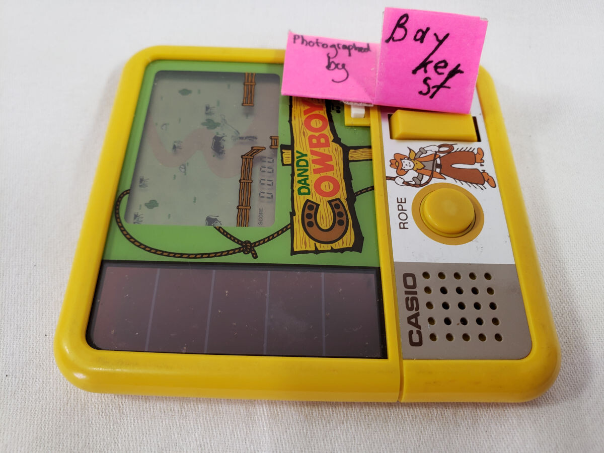 SEE VIDEO Dandy Cowboy LCD Game Solar Power powered CASIO 1983 CG