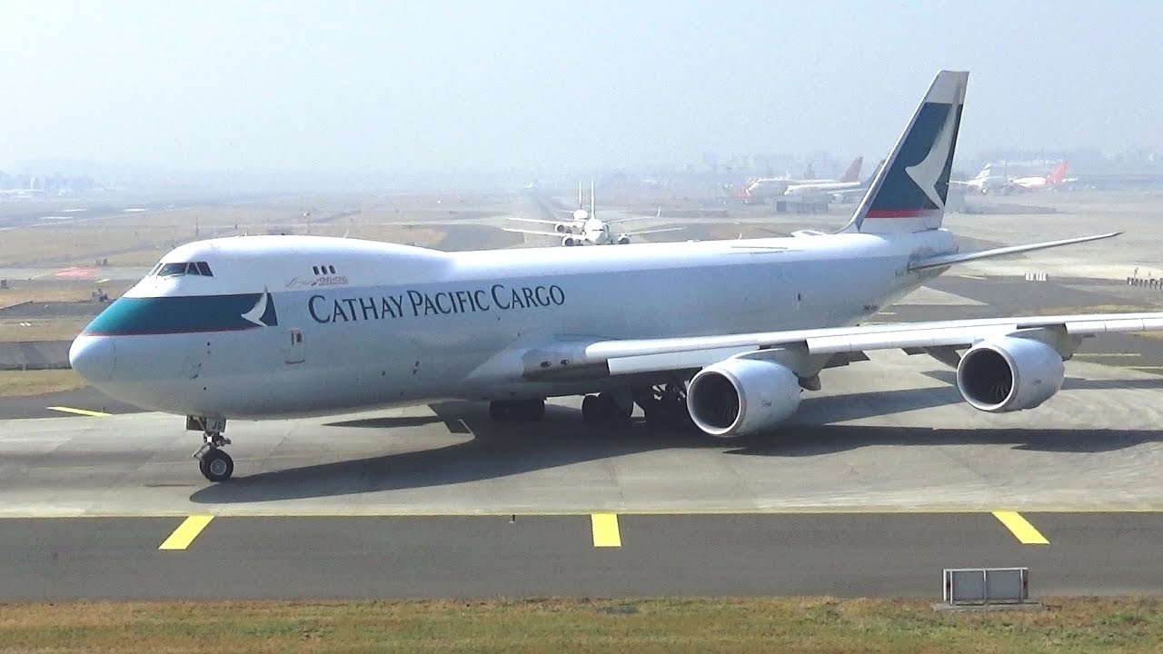 Pilot waving from Super Jumbo Boeing 747-8 Cathay Pacific Cargo