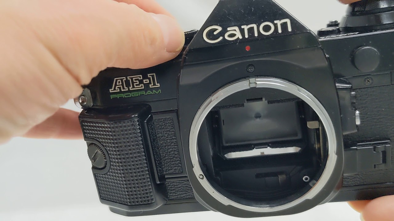 Canon AE-1 Program SLR Camera with New FD 35-70mm F/2.8-3.5 Zoom