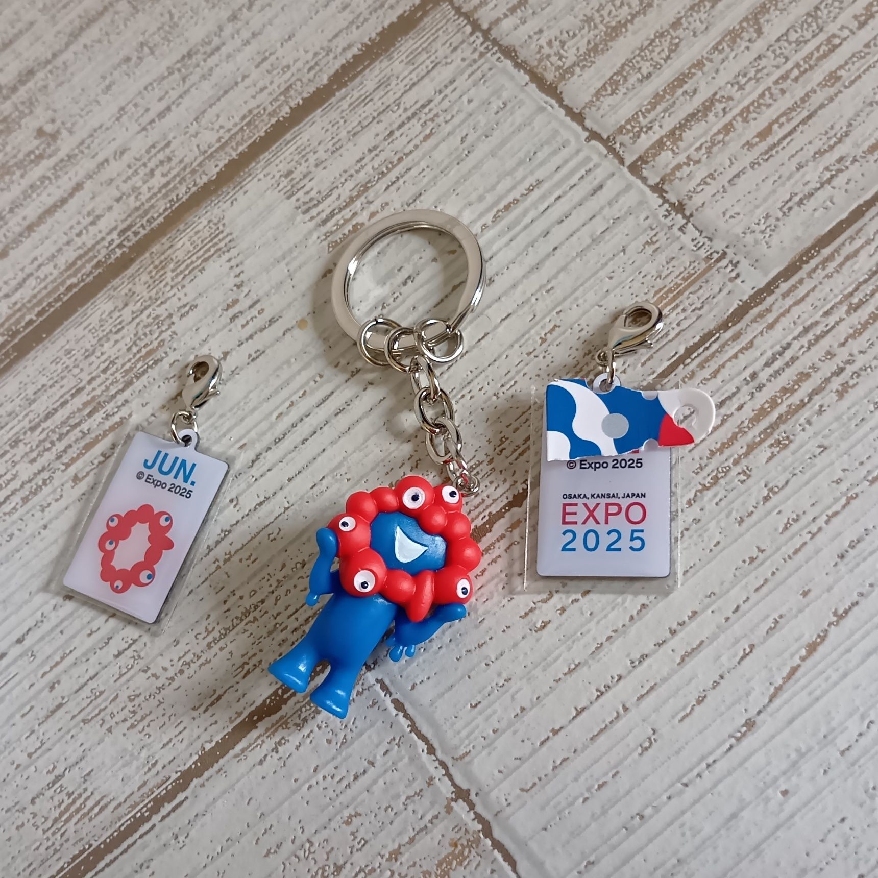 株式会社モノコム 万博公式グッズ：2025アニバーサリーキーホルダーの