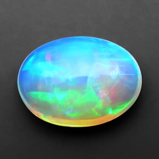 エチオピアオパール ルース 4.17ct 淡橙の地色に橙 緑 赤の遊色