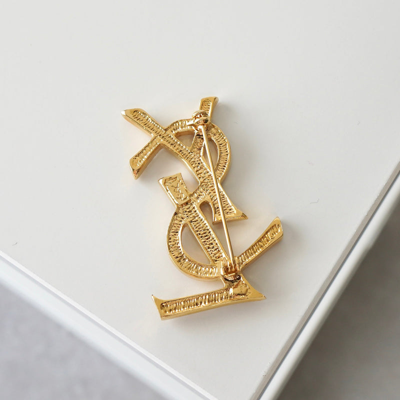 イヴサンローラン カサンドラロゴ YSLロゴ ラインストーン ブローチ GP