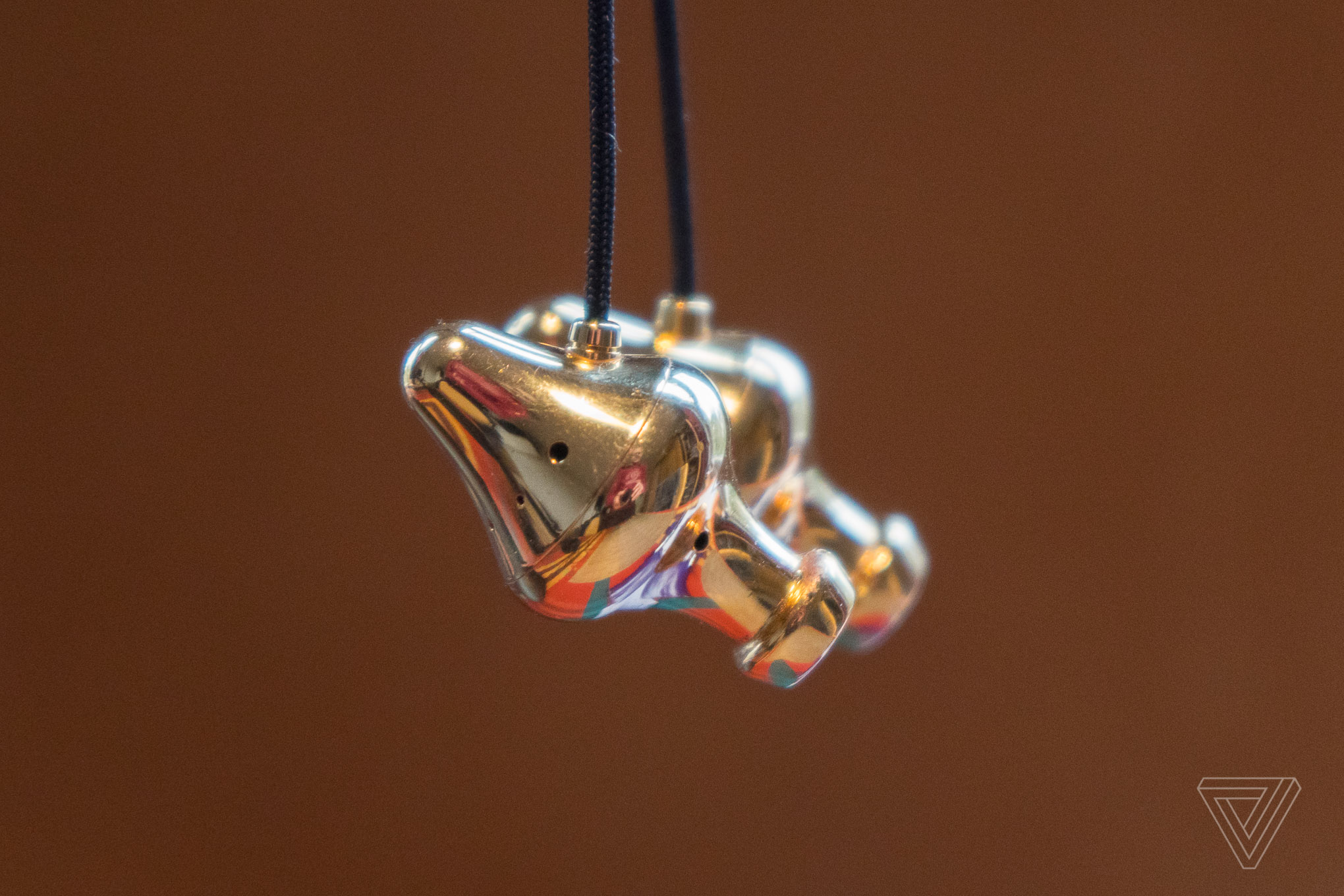 These golden headphones were crafted by a mad genius | The Verge