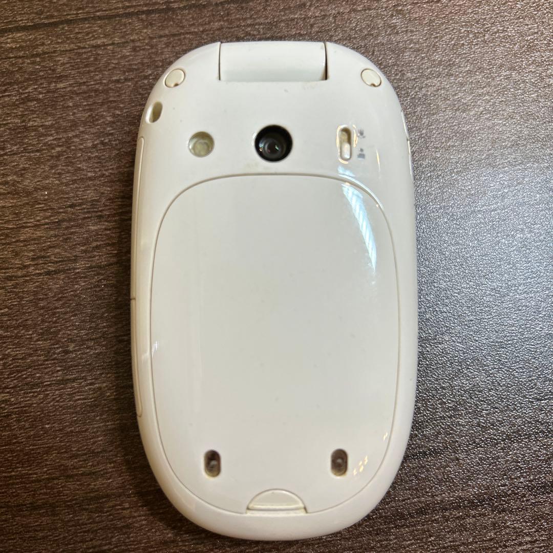 au】ガラケー penck 白 W31H サイトウマコト 箱あり - メルカリ