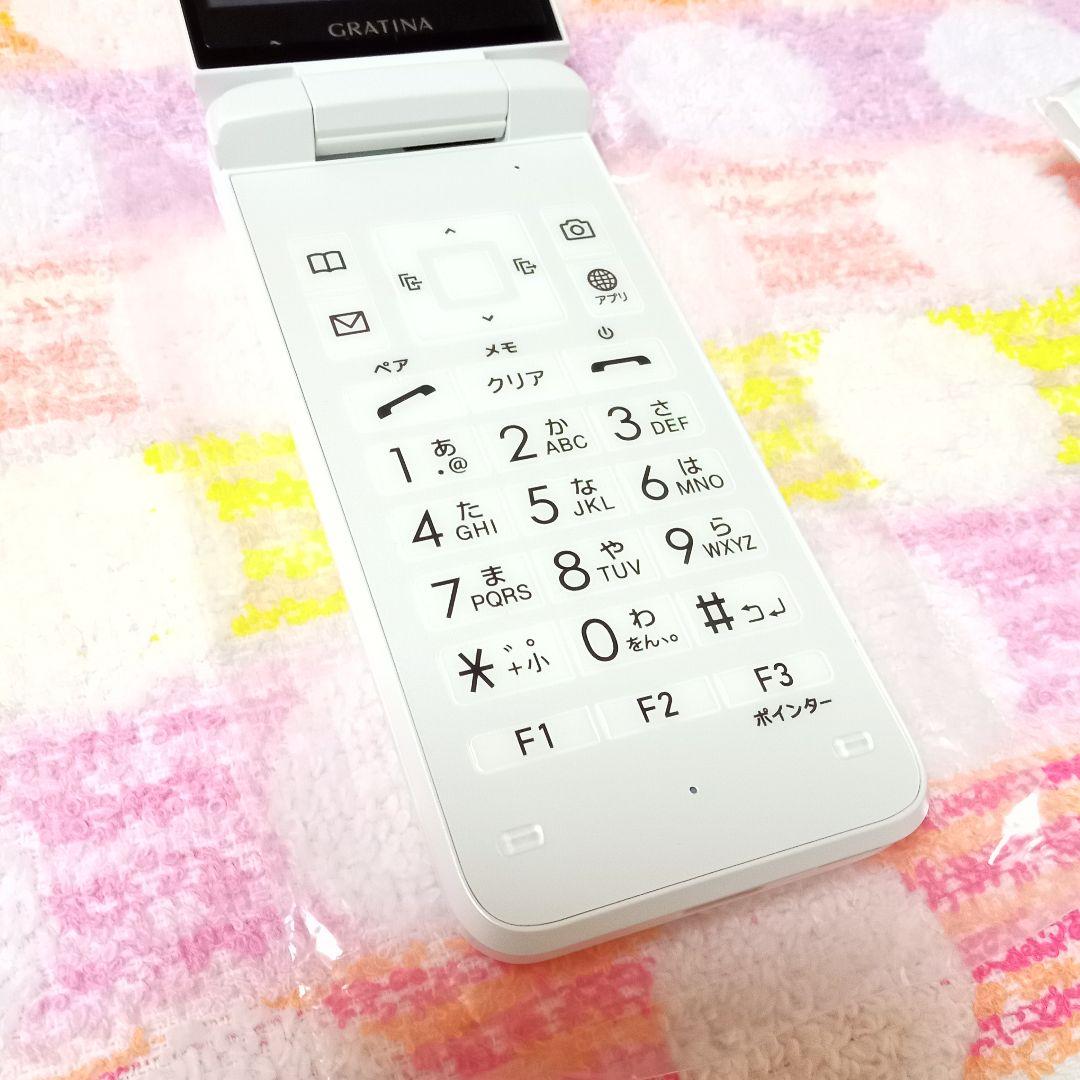 KYF42 GRATINA white 充電器セット 安心のメルカリ便 匿名配送 - メルカリ