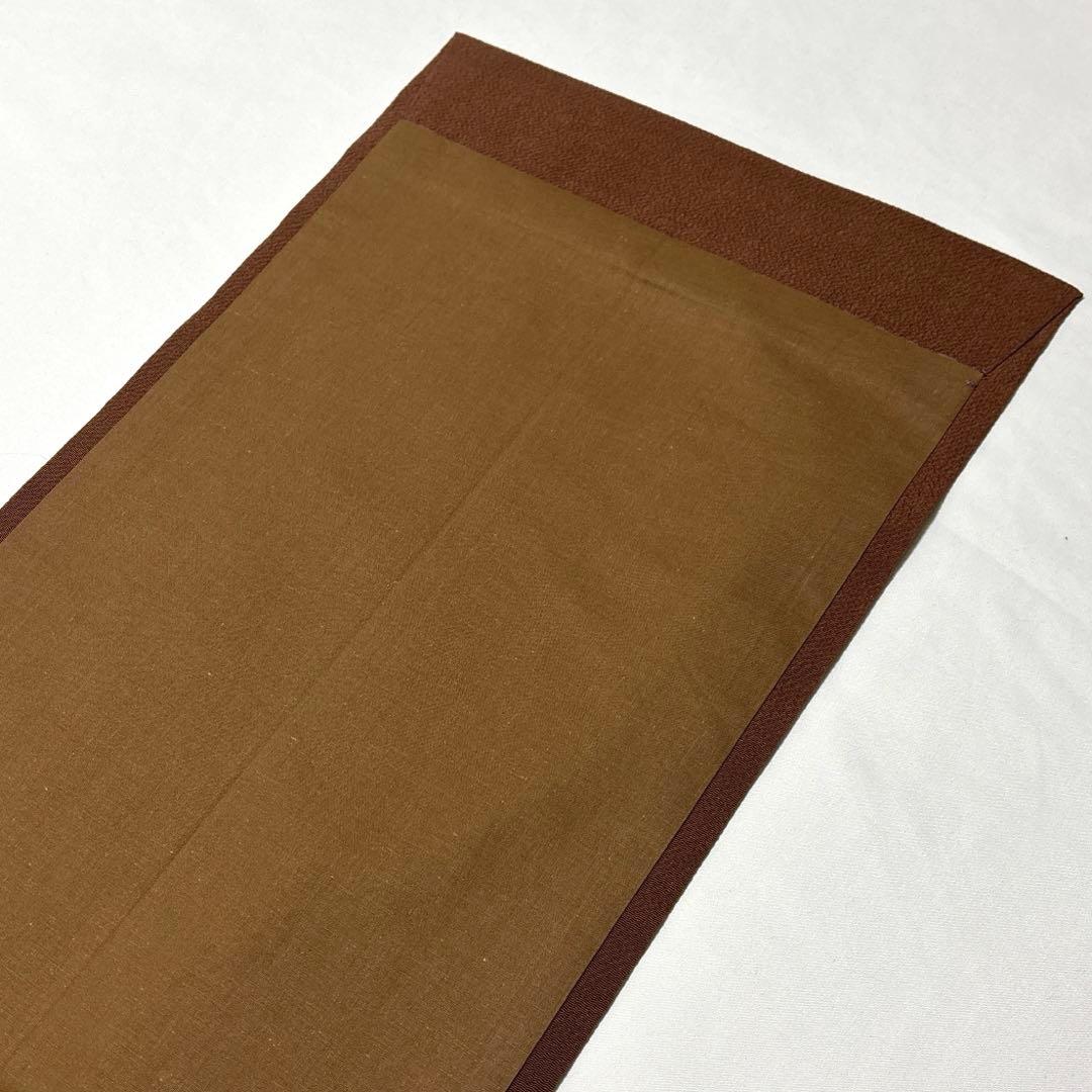 開き名古屋帯【栗山吉三郎】和染紅型 縮緬 垣根文様 茶色 お太鼓柄