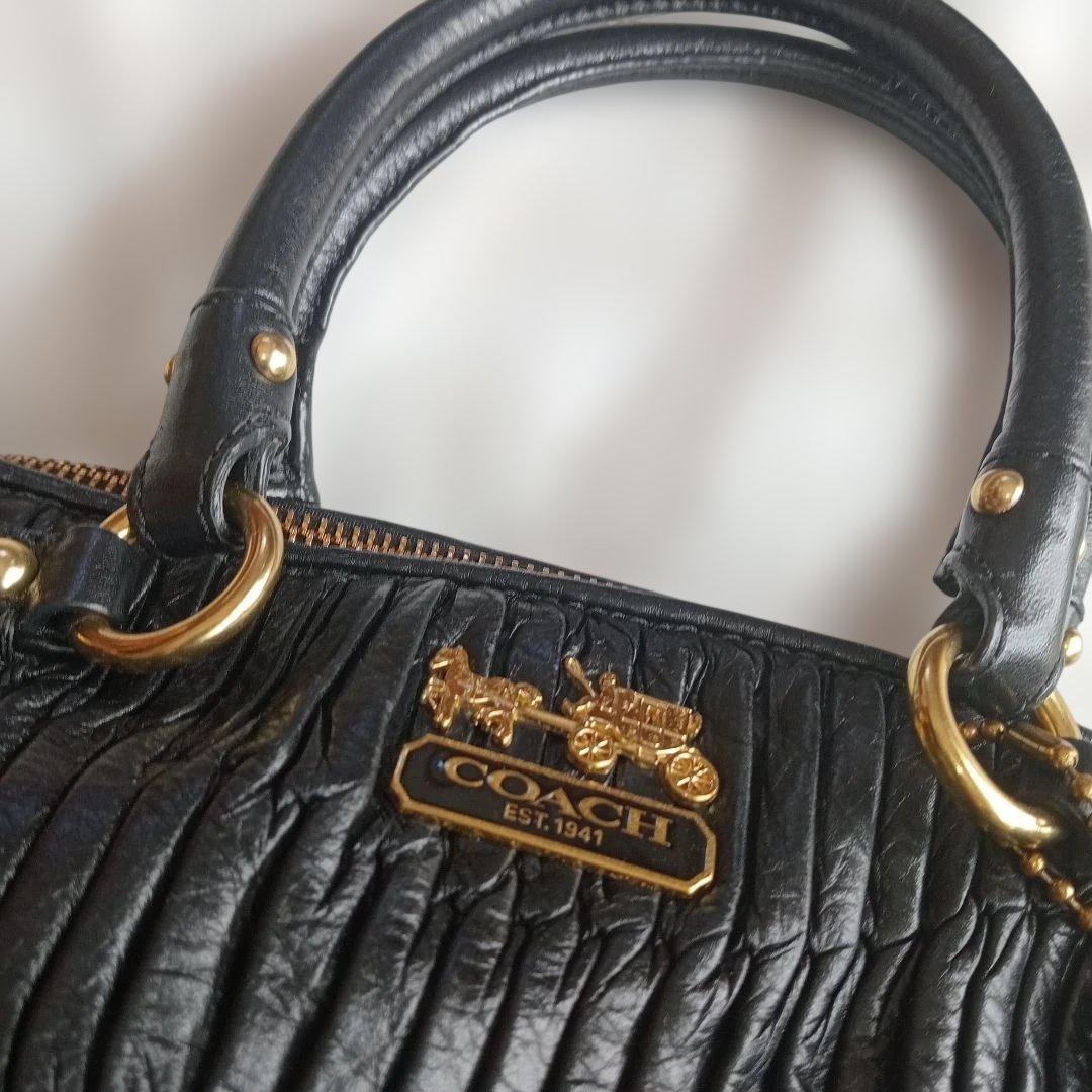 COACH ブラック レザー ハンドバッグ - メルカリ
