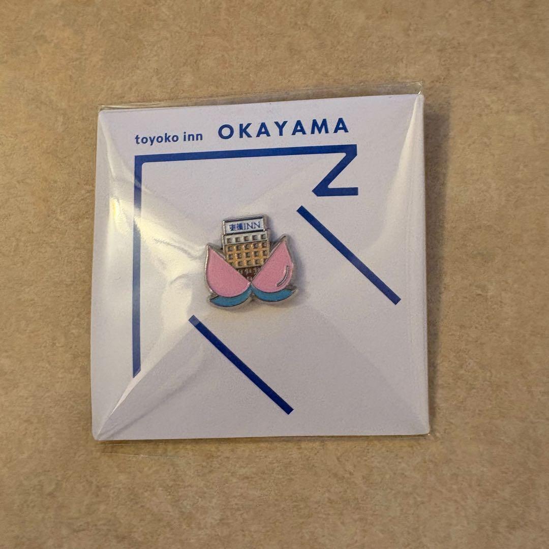 東横イン ピンバッジ ご当地GENKIバッジ 岡山 - メルカリ